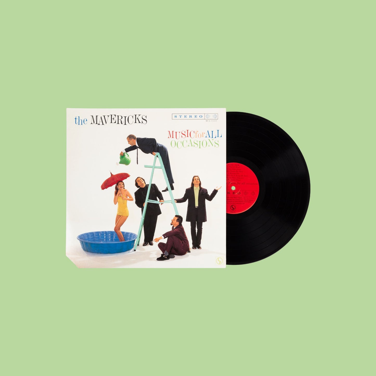 Vinyl record and cover with 'The Mavericks' on a light green background