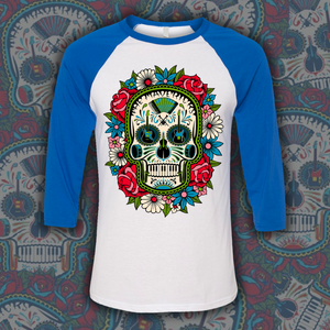 Baseball-style t-shirt with blue sleeves featuring a colorful sugar skull design on the front.