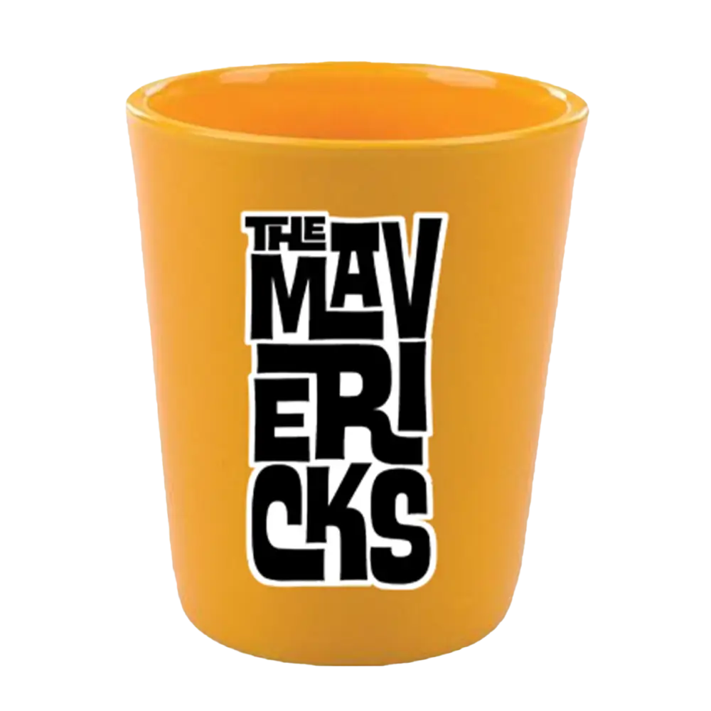 Bright orange shot glass with ’THE MAVERICKS’ printed in black lettering.