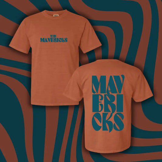 Rust-colored t-shirt with teal text reading ’The Mavericks’ on the front and ’Mavericks’ on the back.